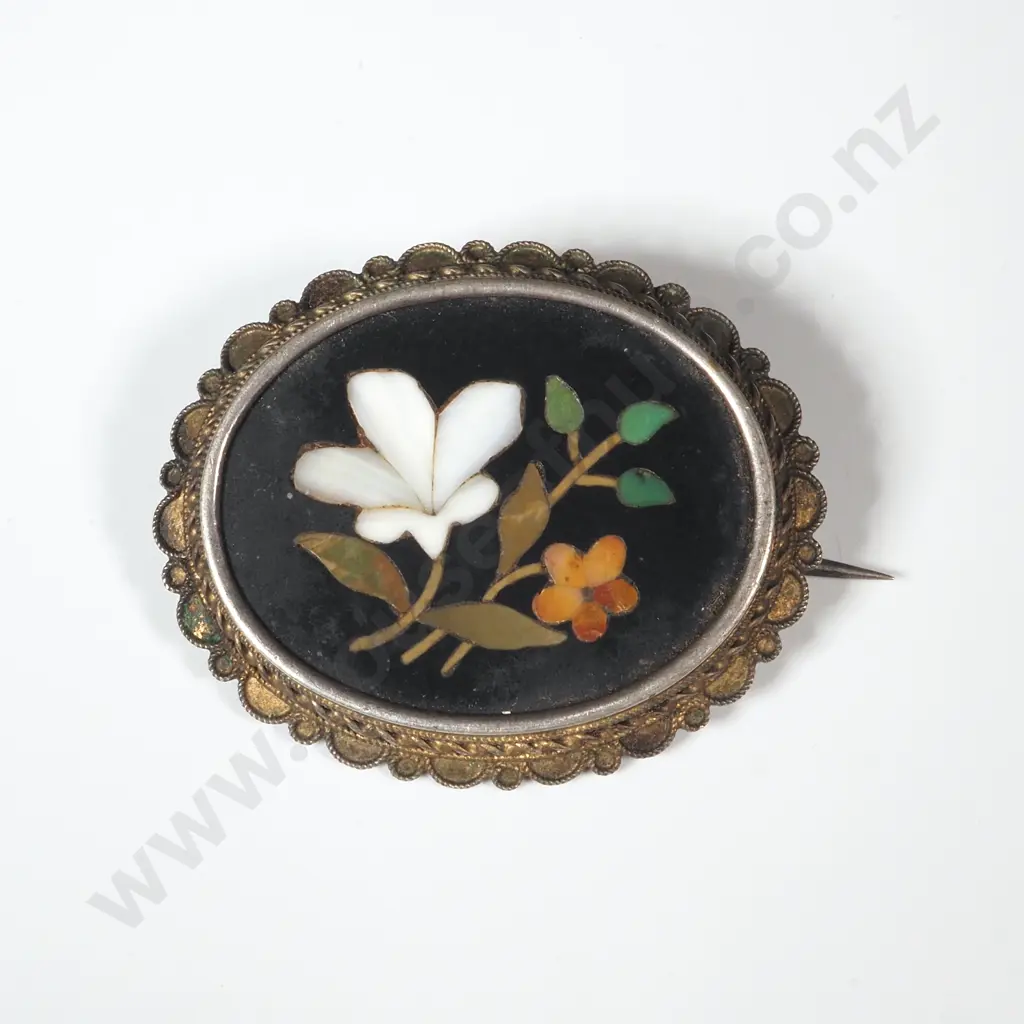A Brooch Inlaid w Flowers & Leaves on Black Ground in a Silver Coloured Mount. Image 1++