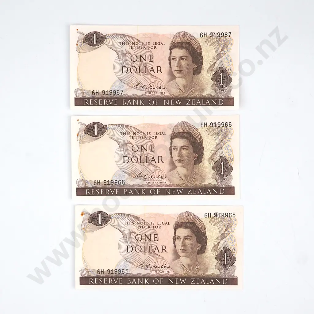 CONSECUTIVELY NUMBERED TRIO WILKS SIGNATURE, SERIALS 6H 919965 / 6/ 7, AUNC BUT WITH TWO RUSTED STAPLE HOLES Image 1++