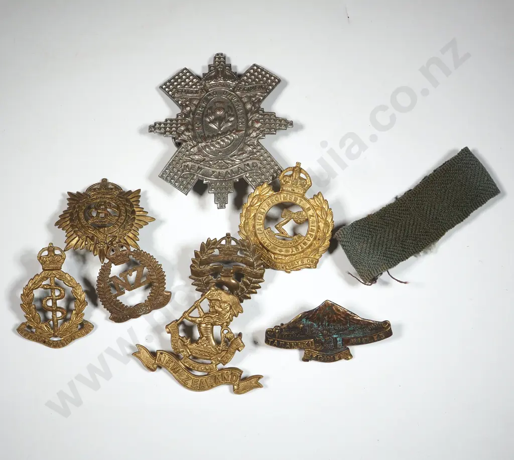 Lot of Eight Assorted NZ WWI & WWII Badges & One Shoulder Title. Image 1++