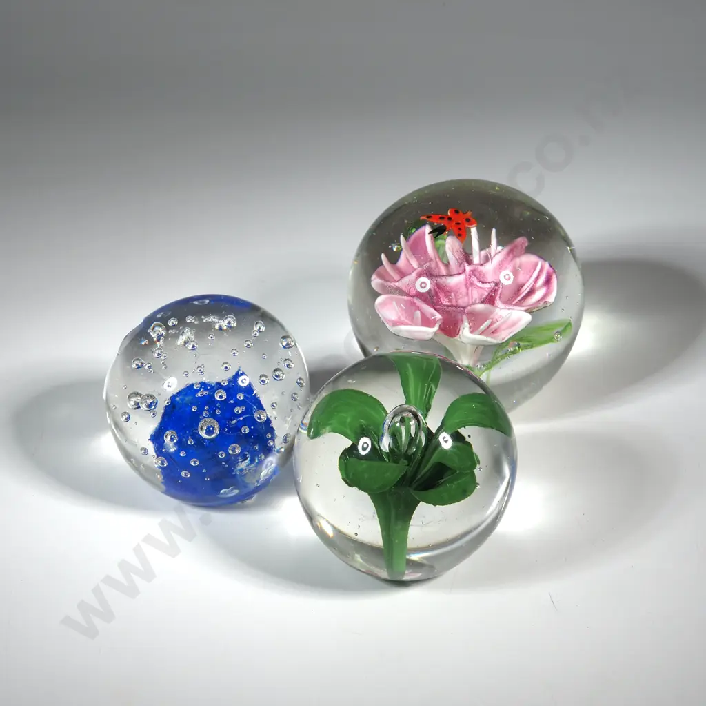 Three Glass Paperweights - One w Blue & Bubbles, A Green Flower Centre & a Pink Flower Centre. Image 1++