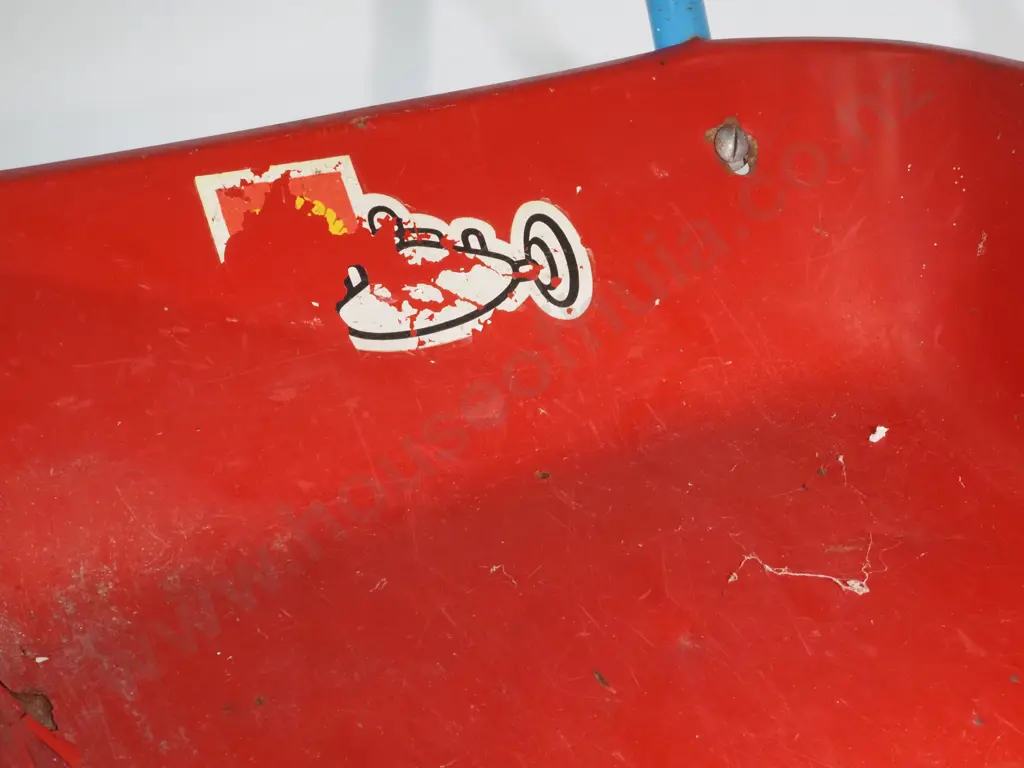 Vintage Metal Child's Wheelbarrow - Red w Blue Handles & Wheels,  Black Rubber Tread & White Handle Grips. Image 1++