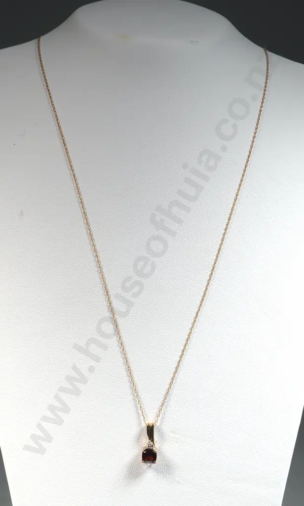 10 ct Gold Pendant & Chain. The Pendant set with A Red Stone (Possibly A Garnet) with White Stone Enhancement Image 1++