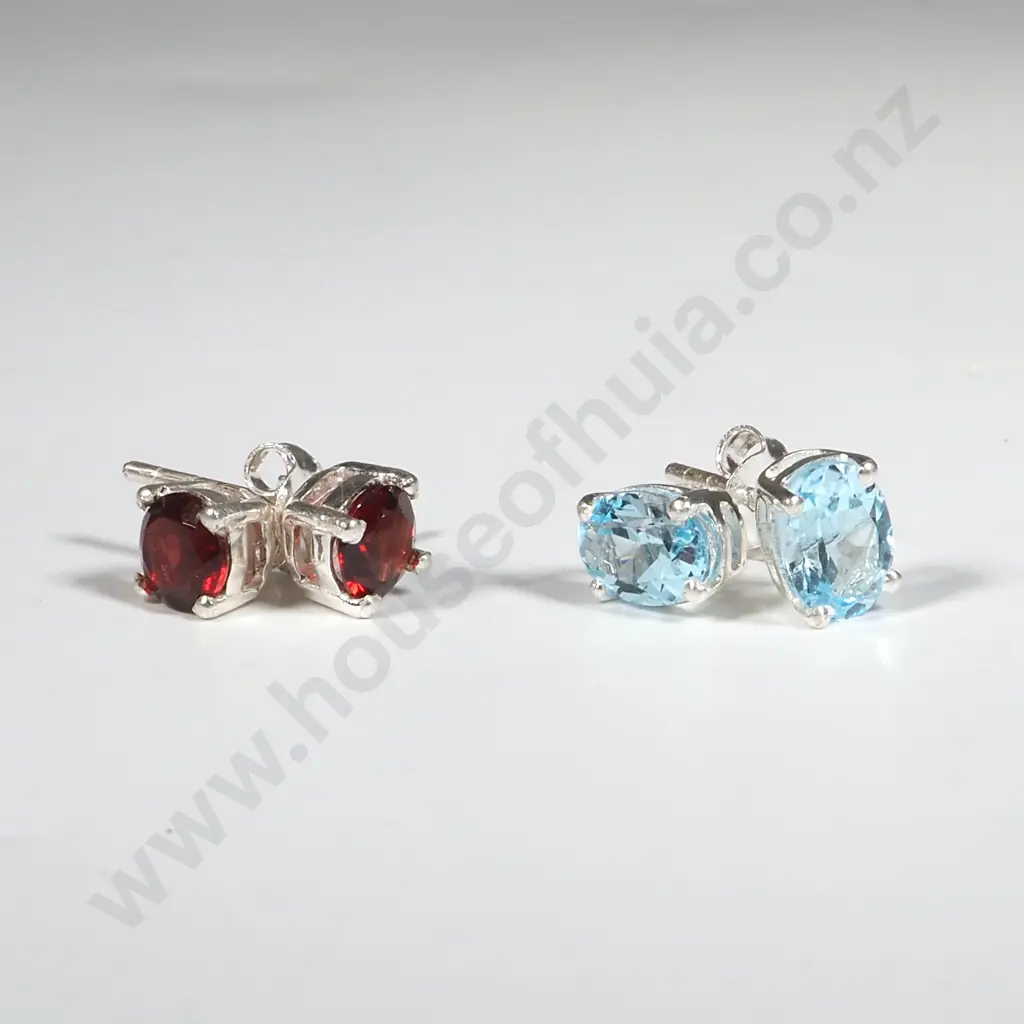 Two Pairs of Sterling Silver Stud Earrings - Blue Topaz & Garnet. Image 1++