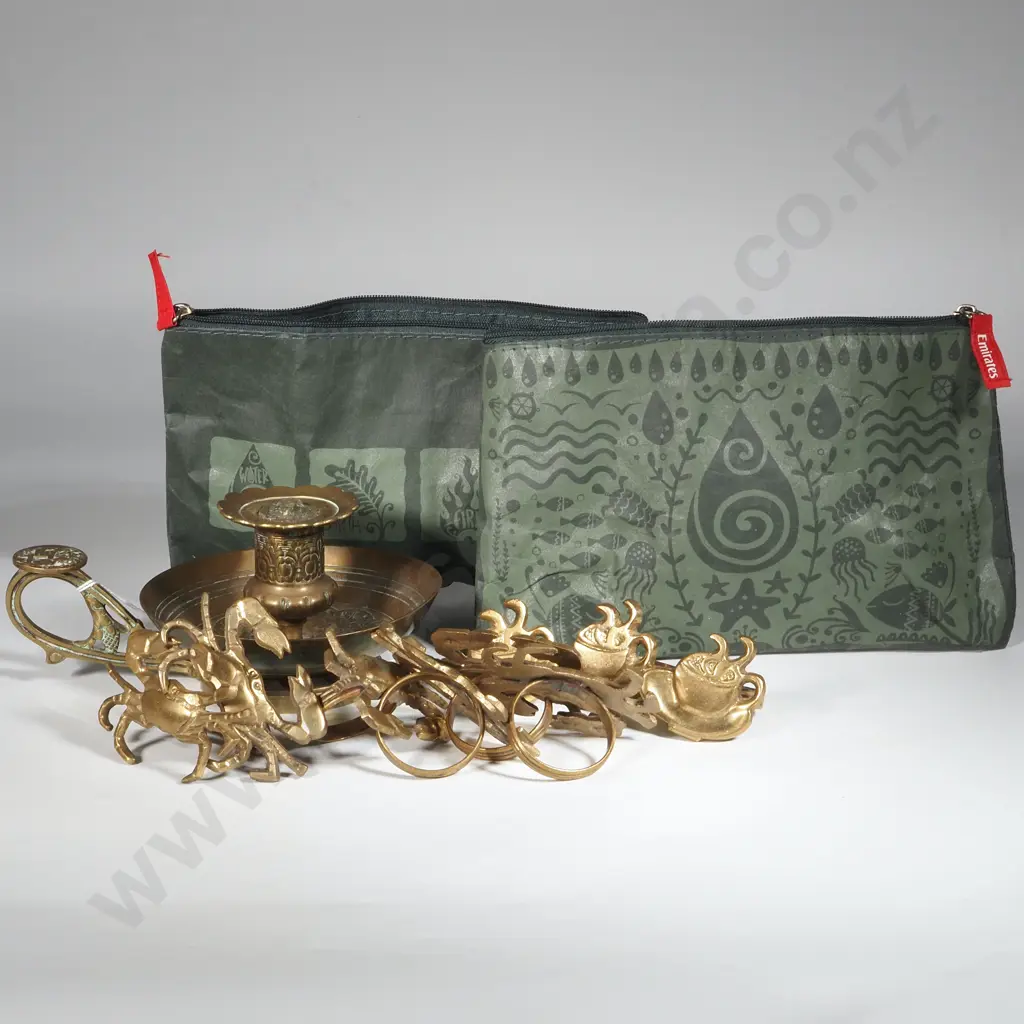 Brass Wee Willie Winkie Candlestick & Collection of Figural Brass Napkin Riings. Image 1++