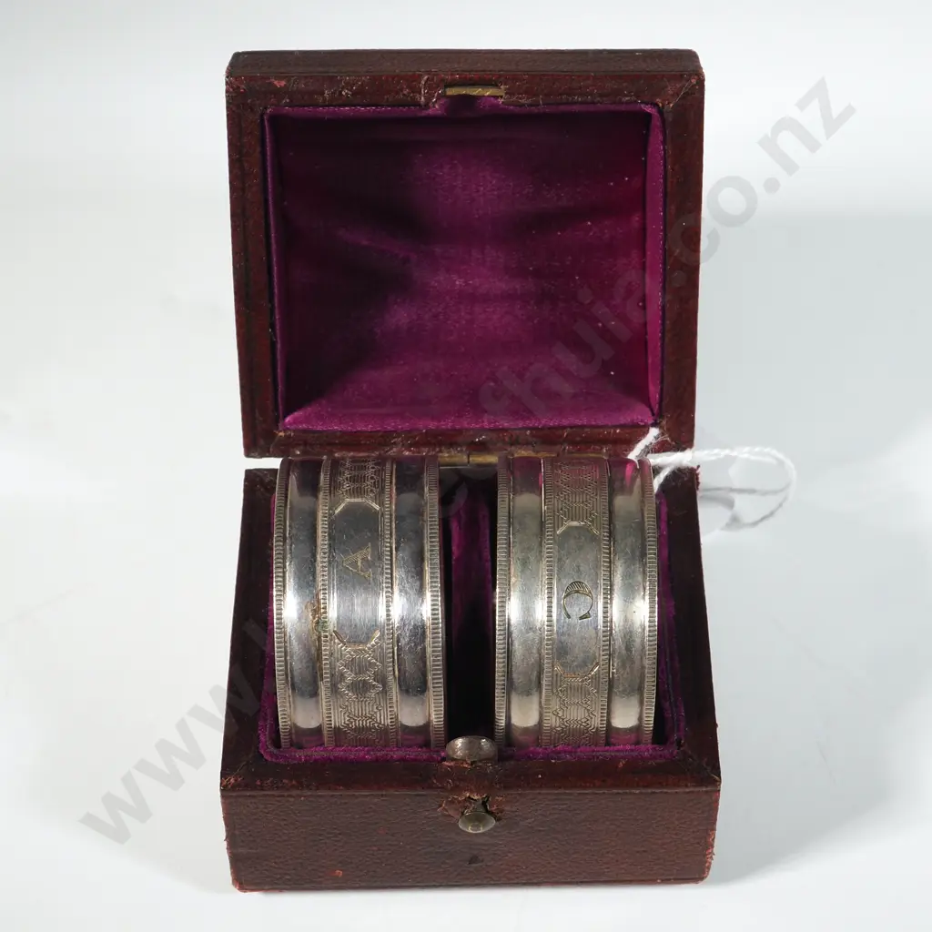 Box Set of Silver Plate Serviette Rings in Domed Leather Case. Image 1++