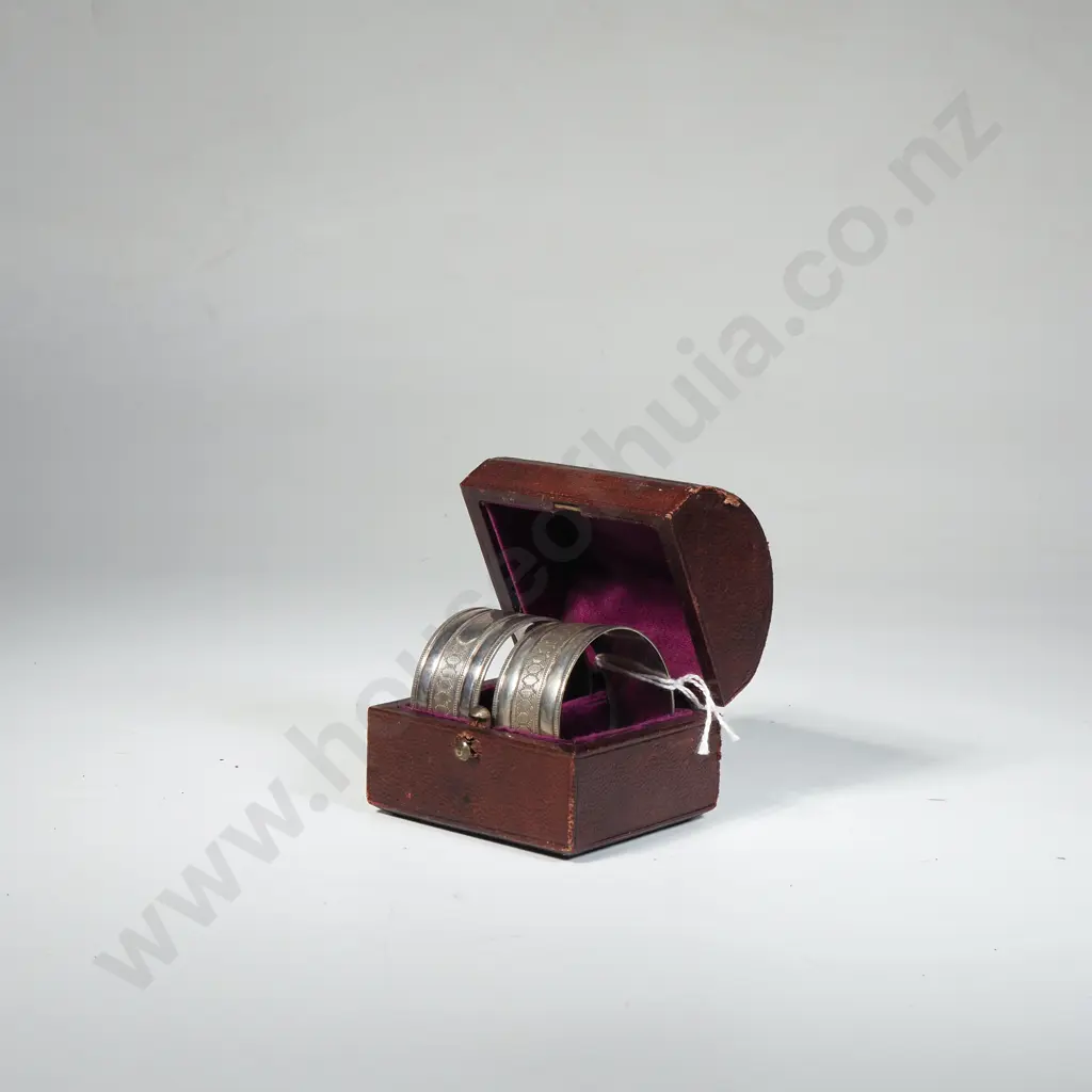 Box Set of Silver Plate Serviette Rings in Domed Leather Case. Image 1++